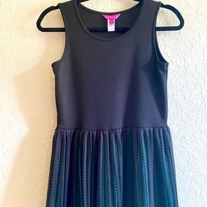 KIDS black dress with teal colored peel a boo slip . Size 12